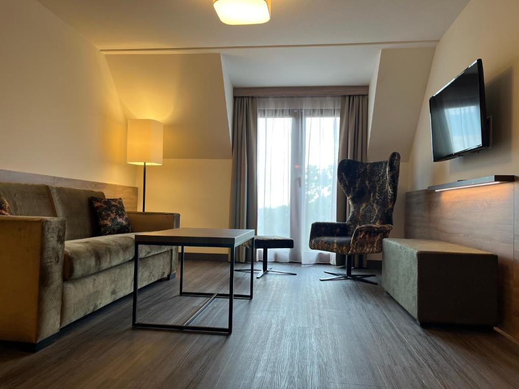 TV a/nebo společenská místnost v ubytování Flair Park Hotel Ilshofen