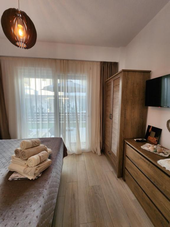 Postel nebo postele na pokoji v ubytování Sol Greco Apartment