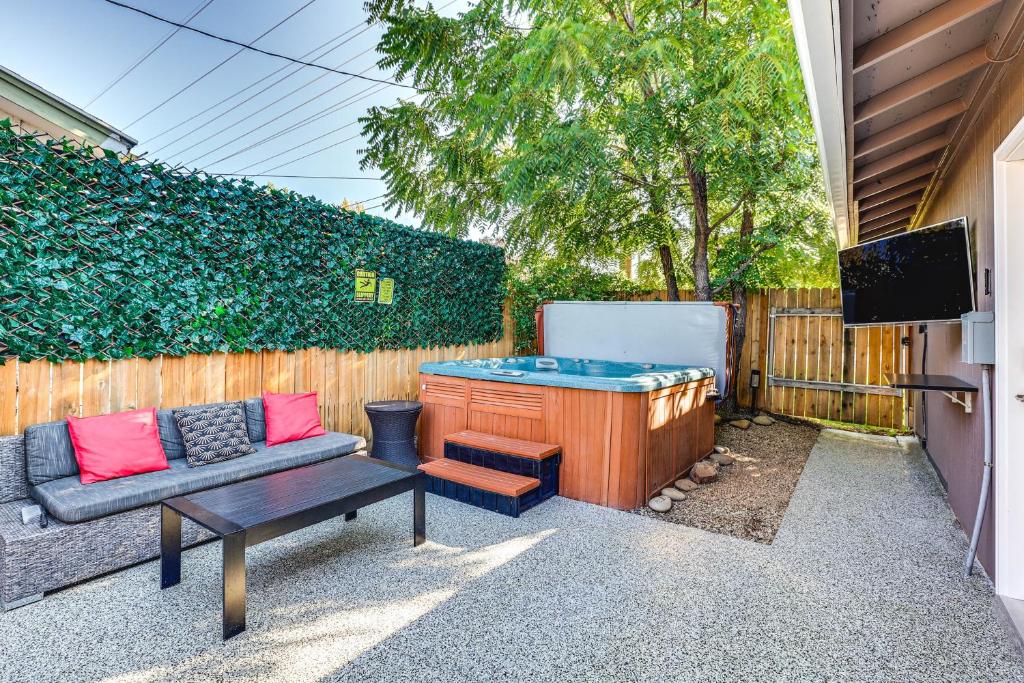 a backyard with a hot tub and a couch at Boise Home with Hot Tub, Yard about 5 Mi to Dtwn! in Boise