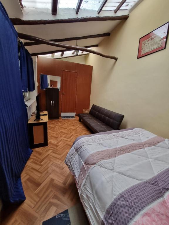 Postel nebo postele na pokoji v ubytování La Casa de Laura - Plaza