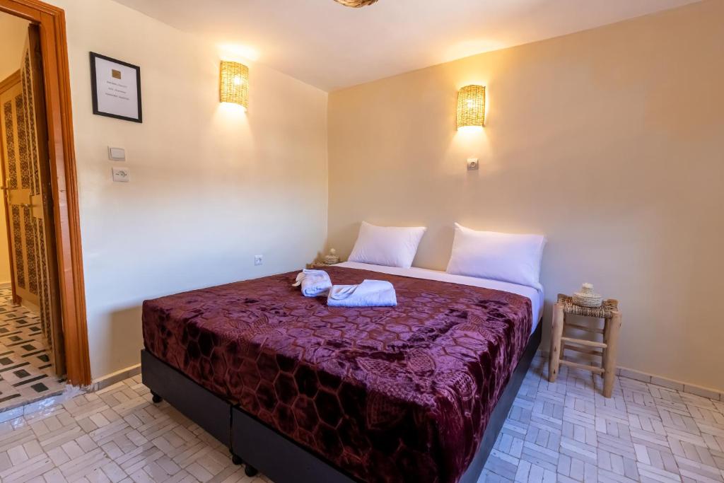 Postel nebo postele na pokoji v ubytování Riad Batha