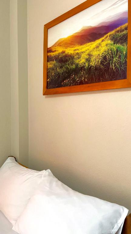 Postel nebo postele na pokoji v ubytování Hostal Laurita Beach