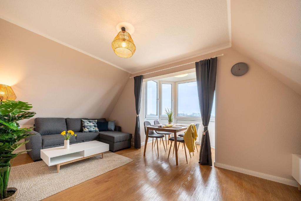 a living room with a couch and a table at Appartement Cappel Whg 22 in Cappel-Neufeld
