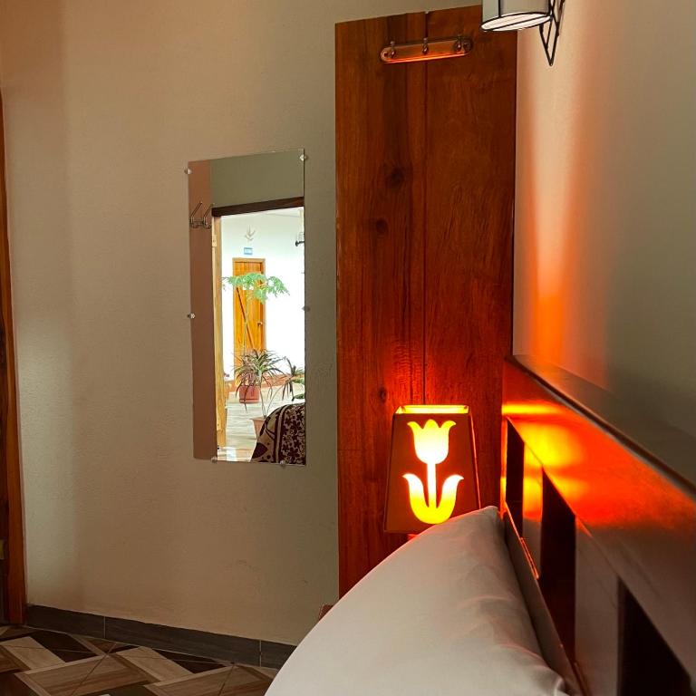 Postel nebo postele na pokoji v ubytování Hostal Laurita Beach