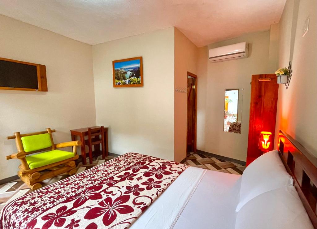 Postel nebo postele na pokoji v ubytování Hostal Laurita Beach