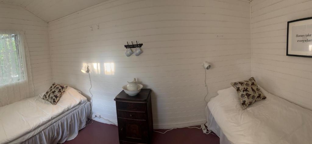 Postel nebo postele na pokoji v ubytování Arphus Lodge