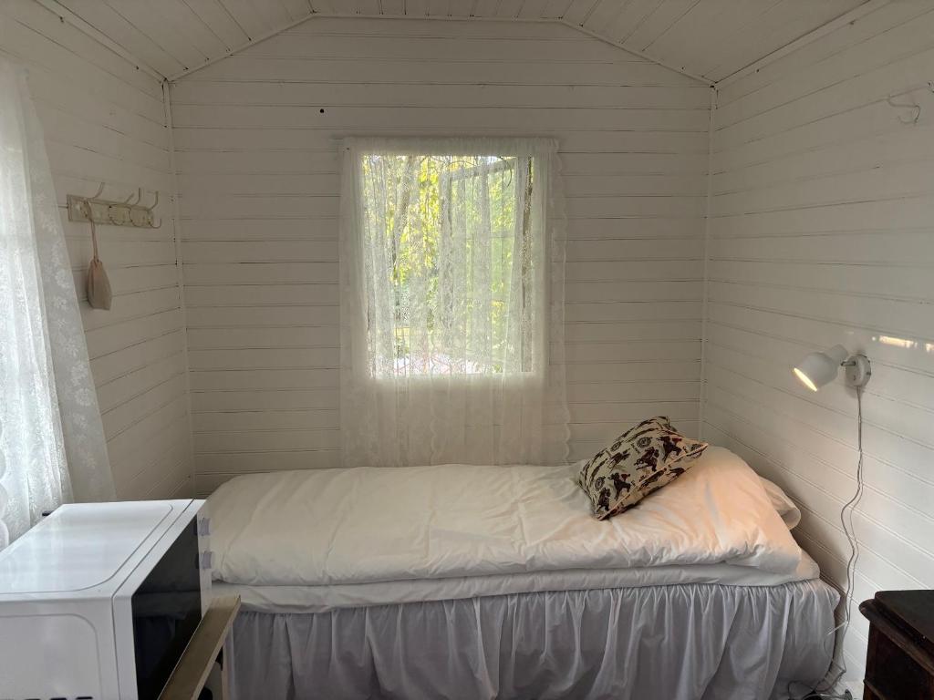 Postel nebo postele na pokoji v ubytování Arphus Lodge