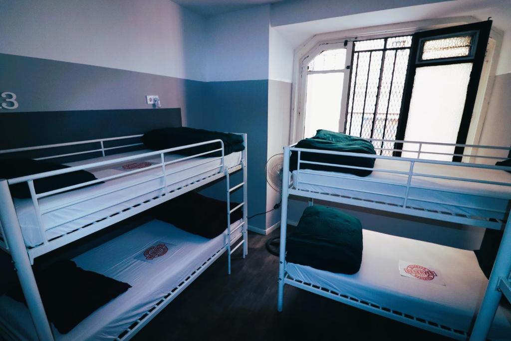 A bed or beds in a room at Madrid Downtown Hostel