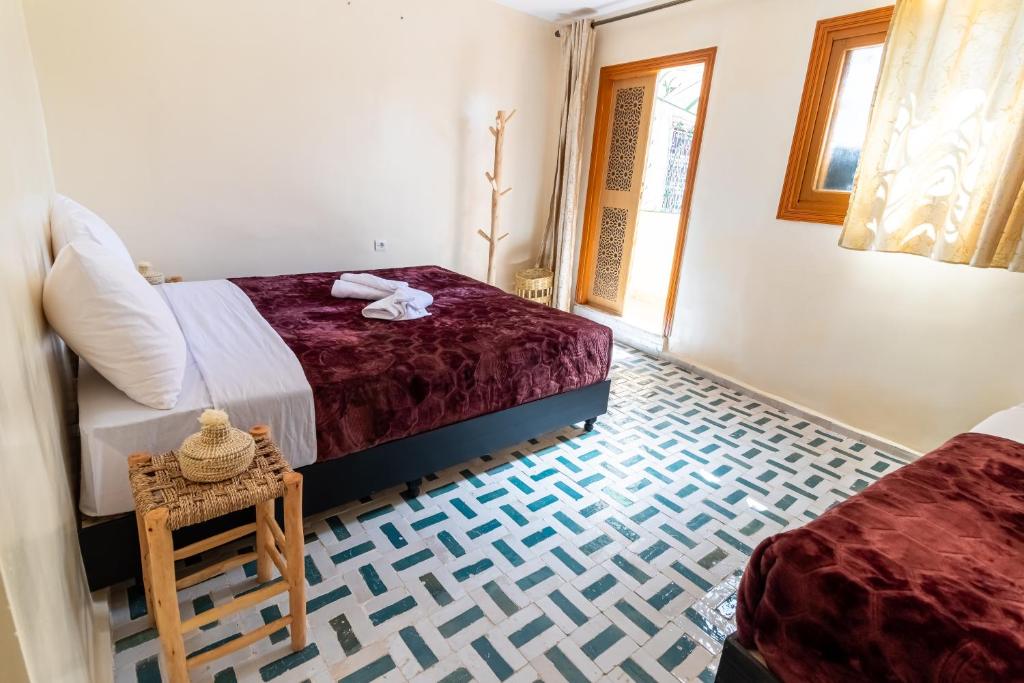 Postel nebo postele na pokoji v ubytování Riad Batha