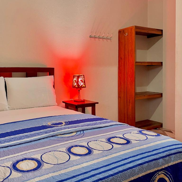 Postel nebo postele na pokoji v ubytování Hostal Laurita Beach