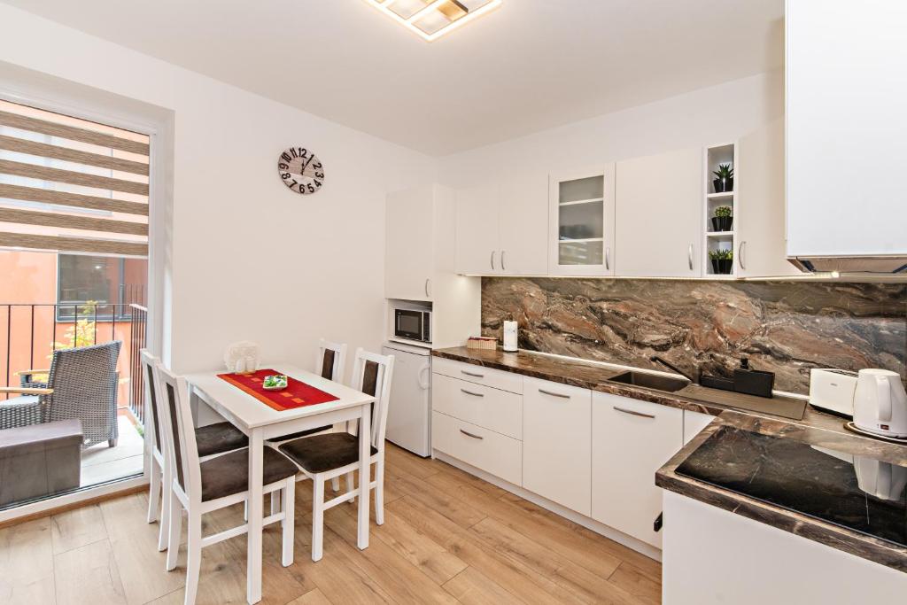Kuchyň nebo kuchyňský kout v ubytování Apartmán Jeannine