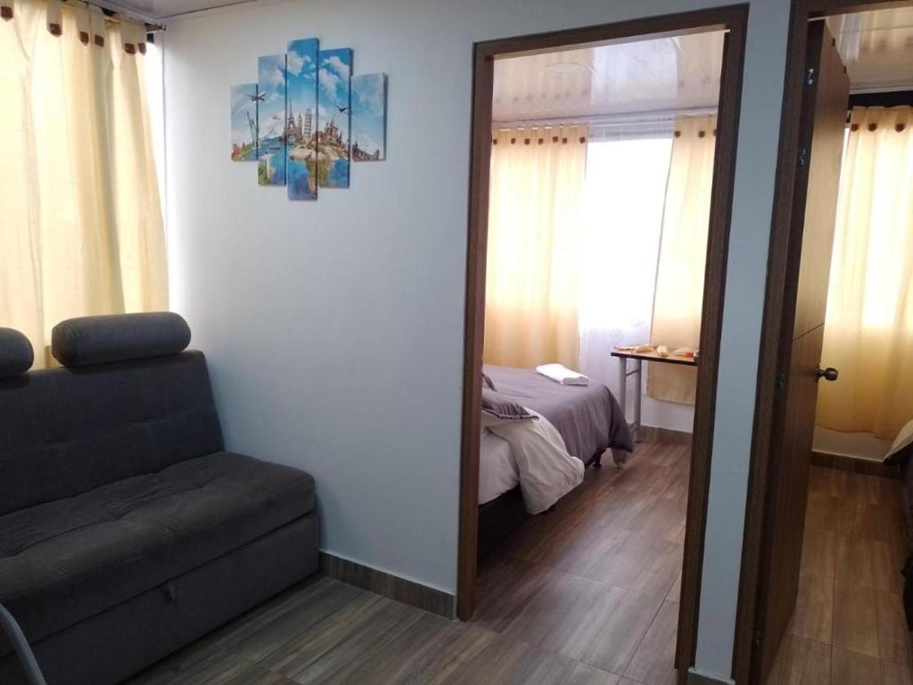 Postel nebo postele na pokoji v ubytování VERDUN ROOMS
