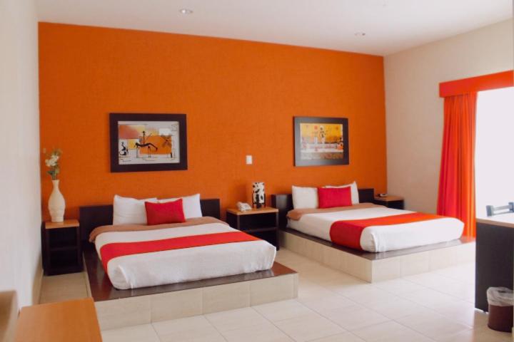 Postel nebo postele na pokoji v ubytování Hotel Real de TX