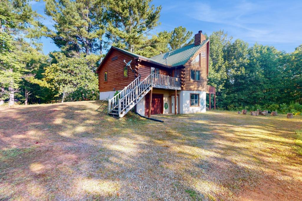 a large house with a staircase in the yard at Alpine Lodge in Salem