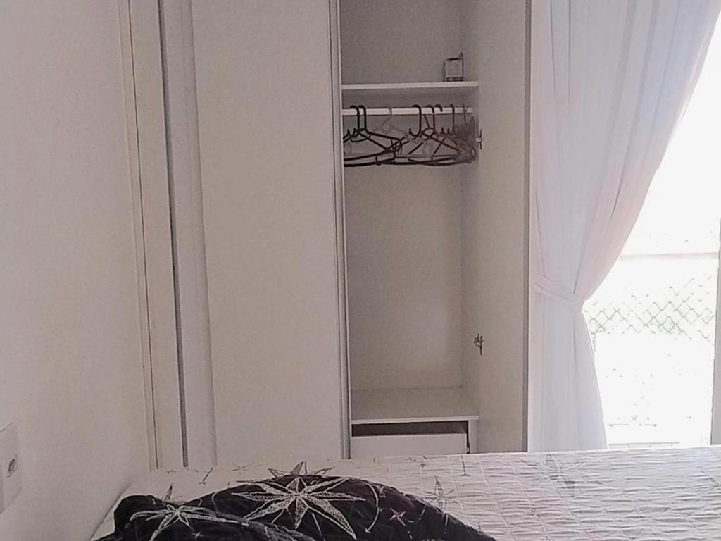 Postel nebo postele na pokoji v ubytování Quartos - Cíntia