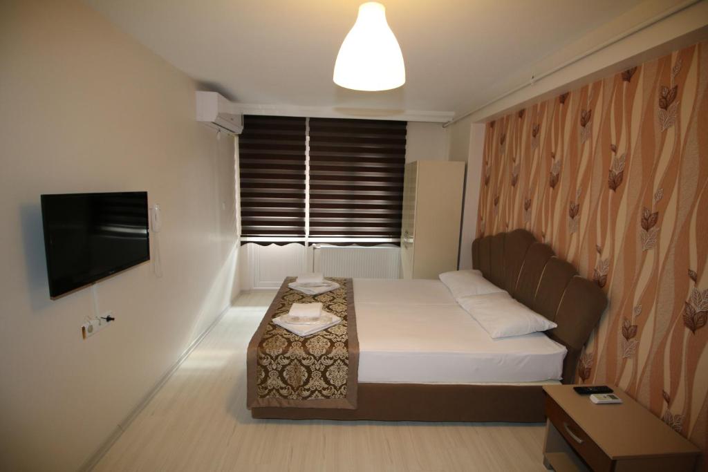 Säng eller sängar i ett rum på Selimiye Hotel