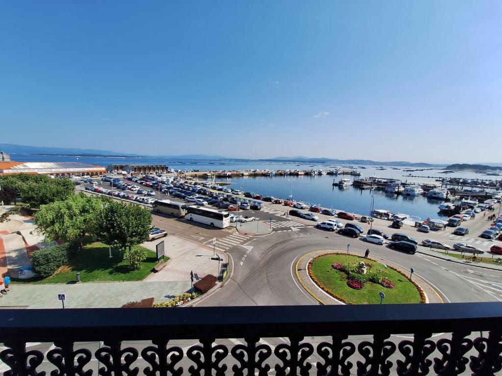 a view of a harbor with cars parked in a parking lot at Piso Beiramar O Grove in O Grove