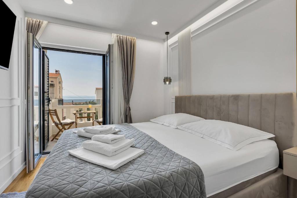 Posteľ alebo postele v izbe v ubytovaní Apartments Luka's View