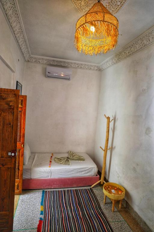 Postel nebo postele na pokoji v ubytování Riad Safran Rouge