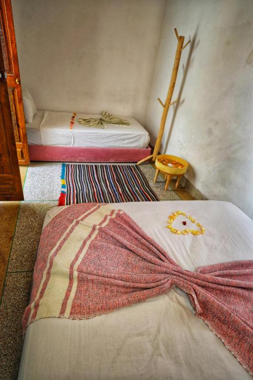 Postel nebo postele na pokoji v ubytování Riad Safran Rouge