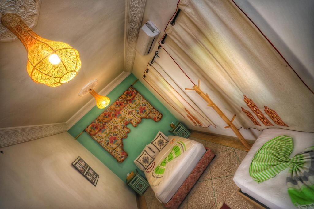 Postel nebo postele na pokoji v ubytování Riad Safran Rouge