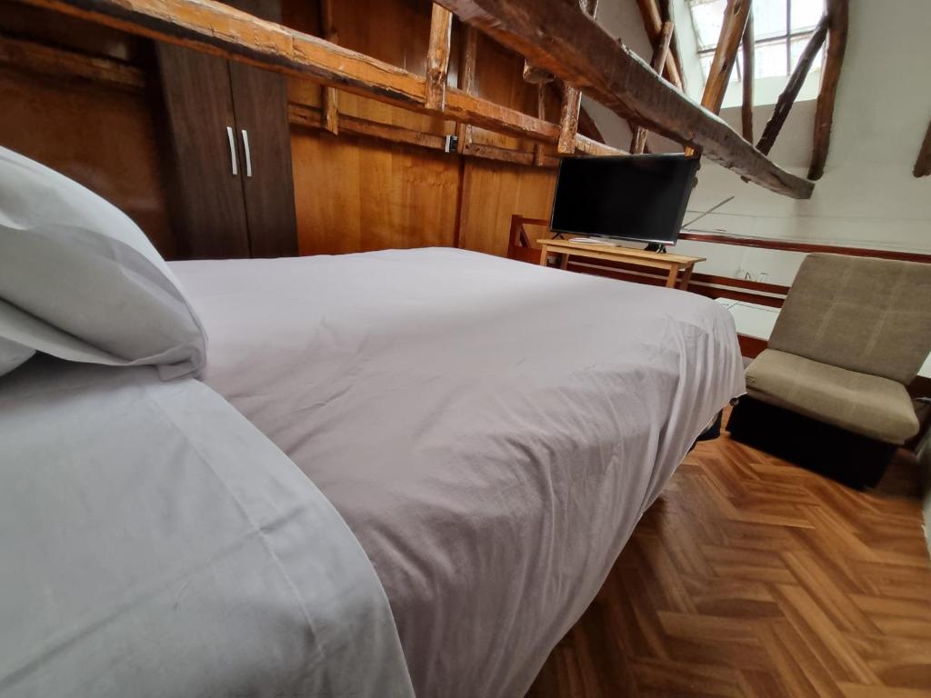 Postel nebo postele na pokoji v ubytování La Casa de Laura - Plaza