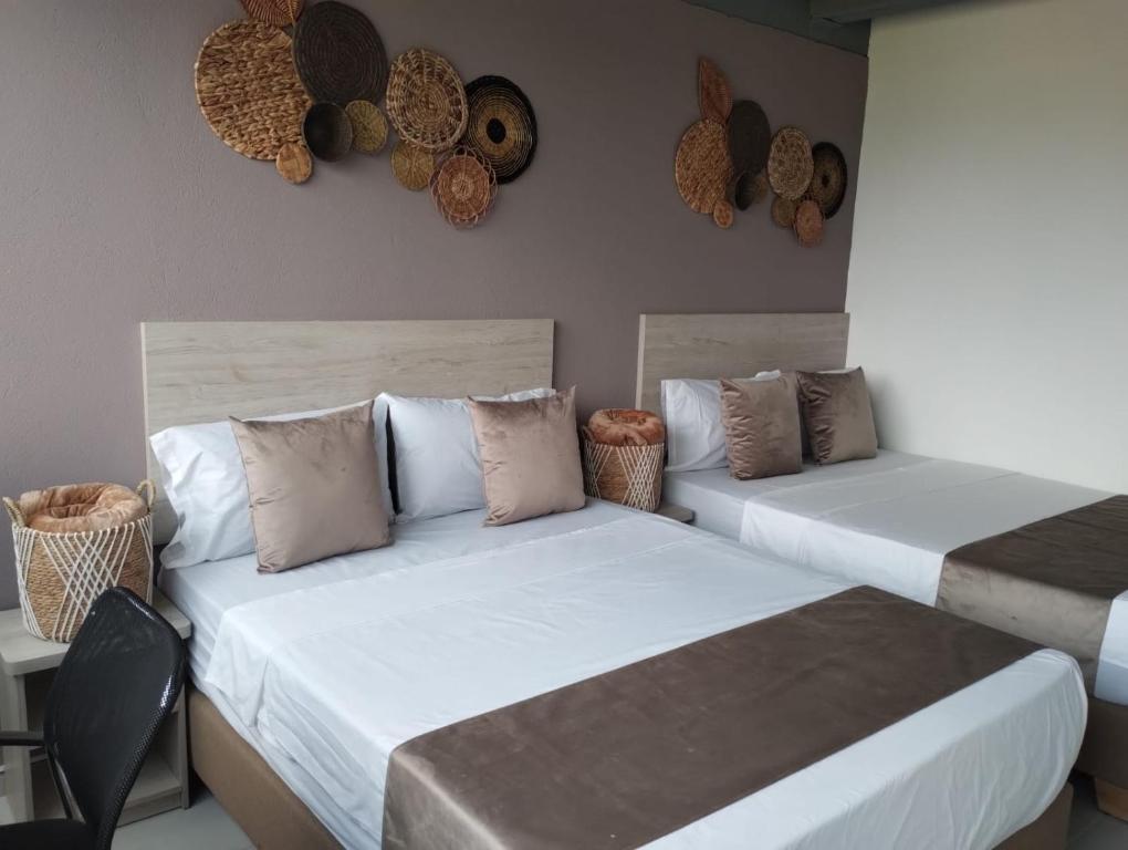 Postel nebo postele na pokoji v ubytování Hotel Med Llanogrande