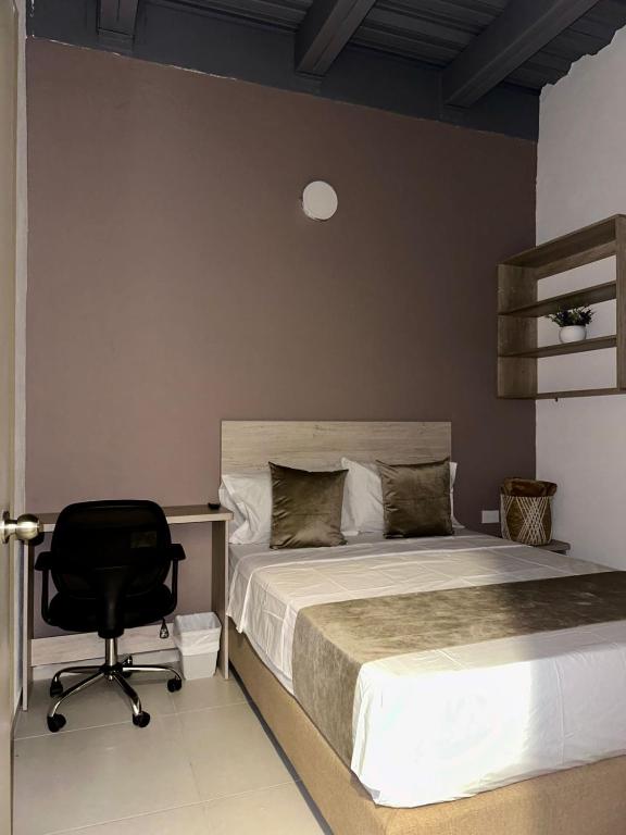 Postel nebo postele na pokoji v ubytování Hotel Med Llanogrande