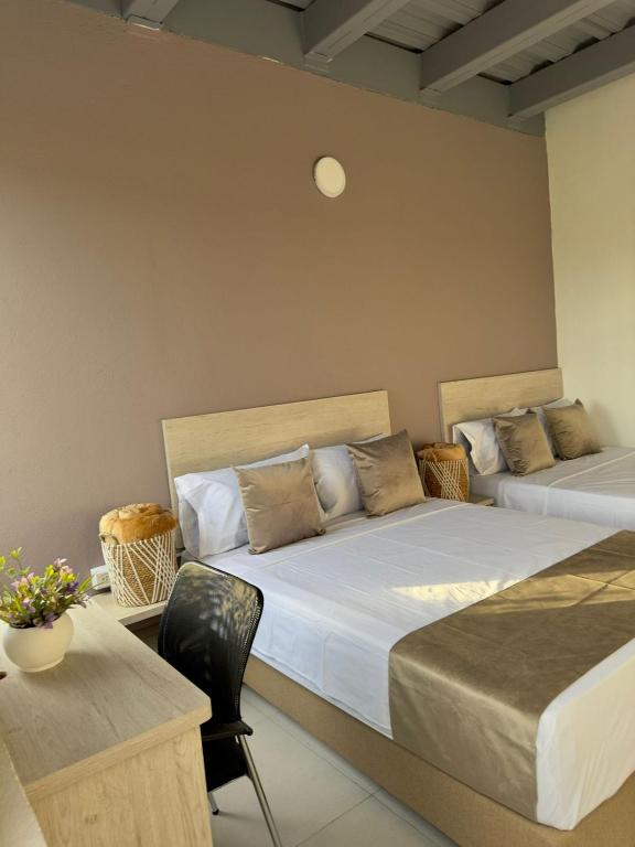 Postel nebo postele na pokoji v ubytování Hotel Med Llanogrande