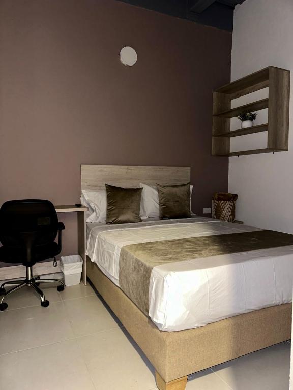 Postel nebo postele na pokoji v ubytování Hotel Med Llanogrande