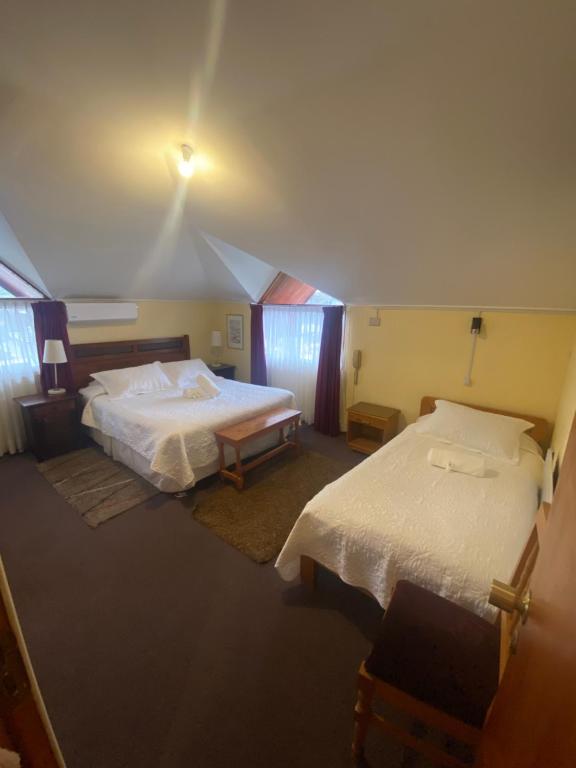 Cama ou camas em um quarto em Hotel Küyen-Ko Pucón