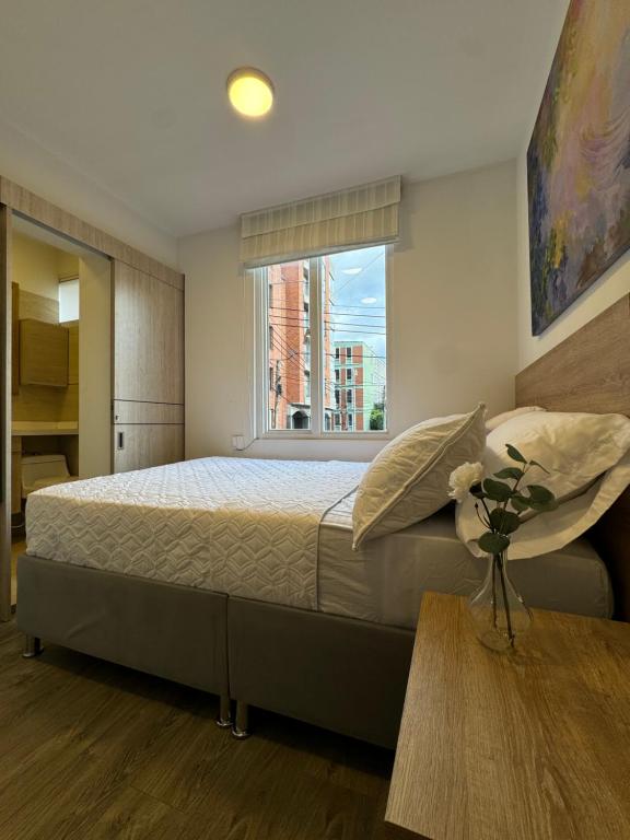 Postel nebo postele na pokoji v ubytování Hostelfc Javeriana