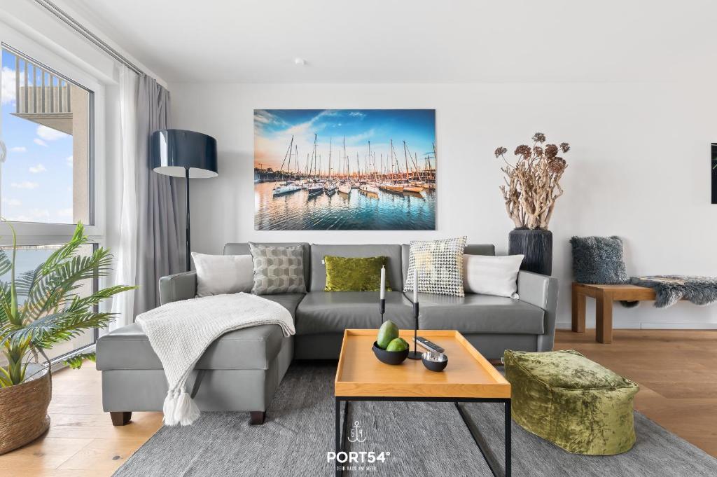 a living room with a couch and a table at Ferienwohnung Harbour Side, App 7 Olpenitz in Olpenitz