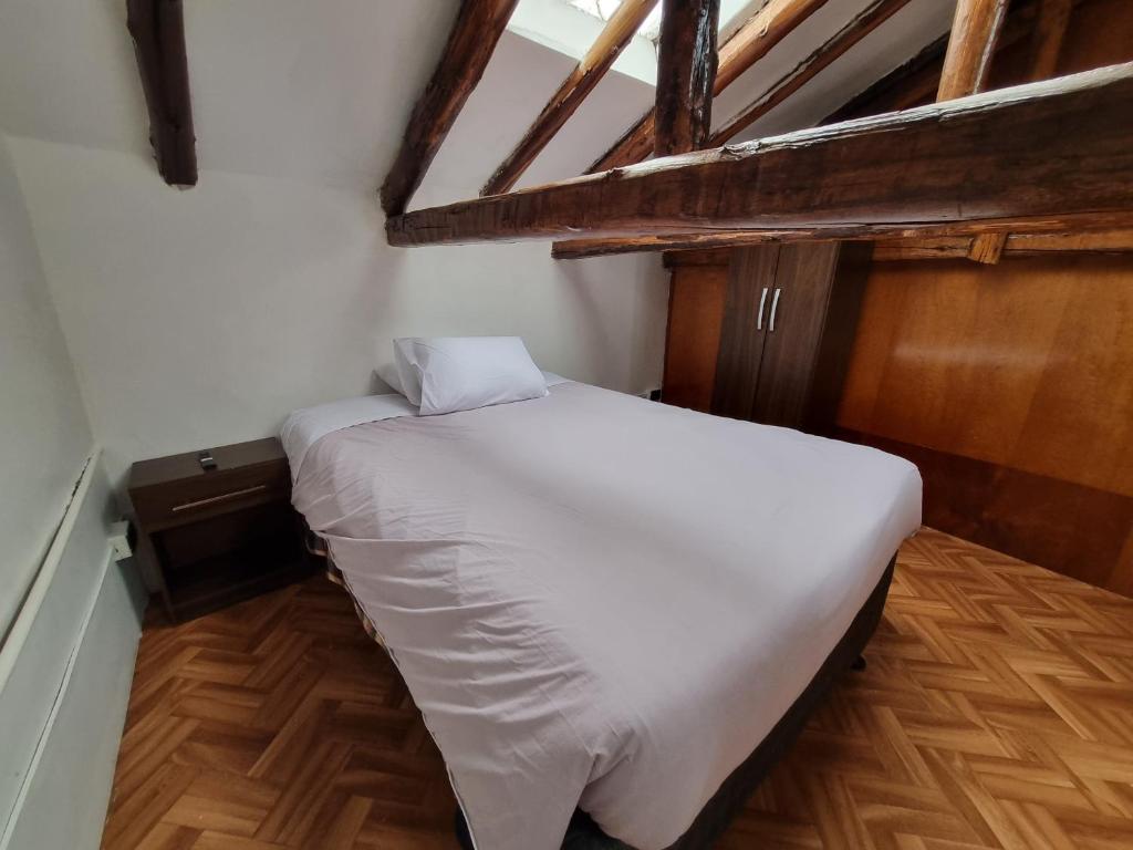 Postel nebo postele na pokoji v ubytování La Casa de Laura - Plaza