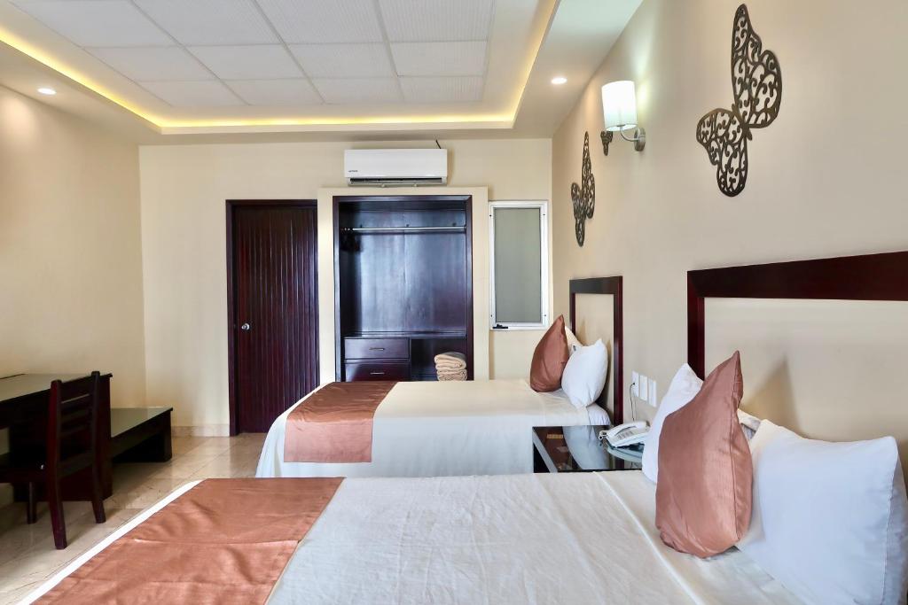 Letto o letti in una camera di Hotel Yorio Inn