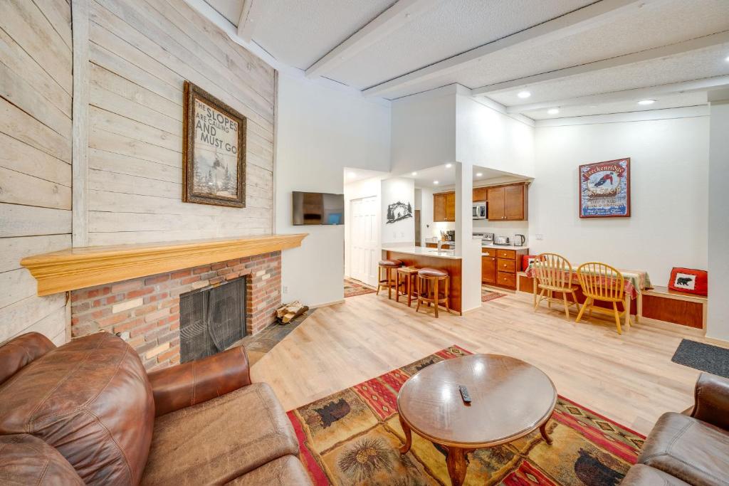 a living room with a couch and a fireplace at Near Hiking Renovated Breck Condo with Tennis Court in Breckenridge