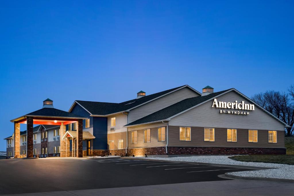 a rendering of the entrance to an antioch inn at AmericInn by Wyndham Williamsburg in Williamsburg
