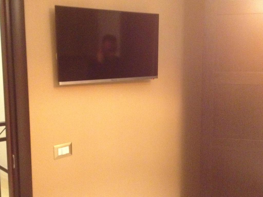 TV a/nebo společenská místnost v ubytování Terrazza Partenopea