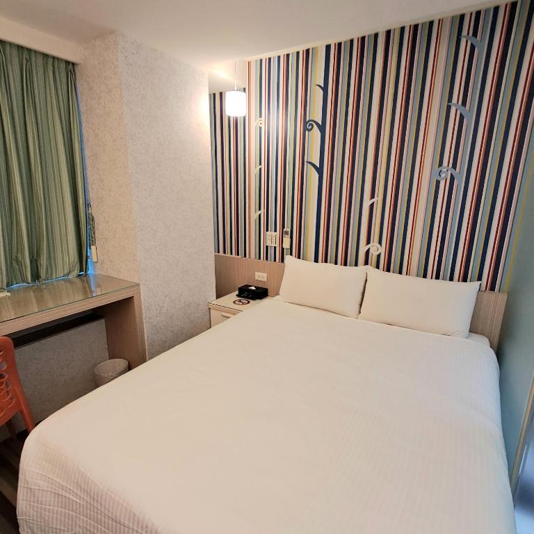 Voodi või voodid majutusasutuse Morwing Hotel Fuzhong toas