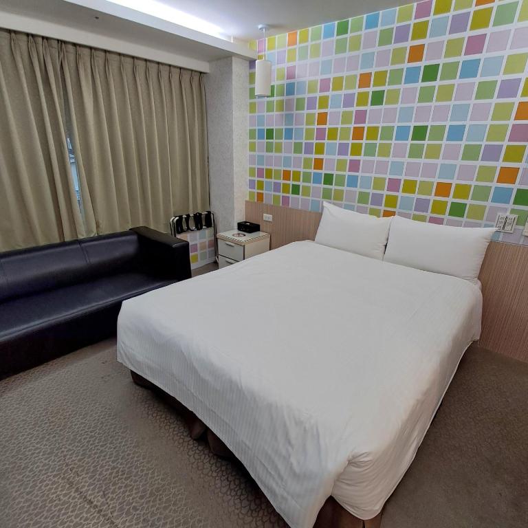 Voodi või voodid majutusasutuse Morwing Hotel Fuzhong toas