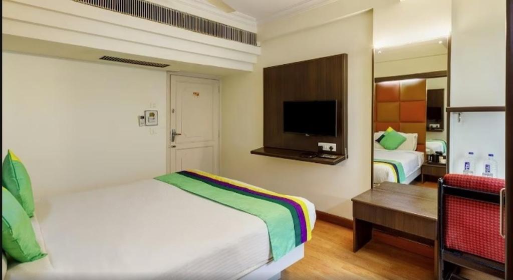 Postel nebo postele na pokoji v ubytování Hotel Crown