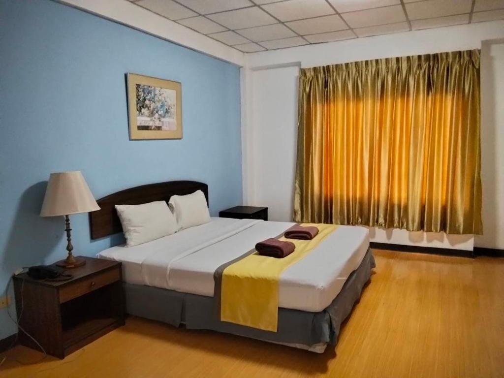 Postel nebo postele na pokoji v ubytování Orchid Residence Samui