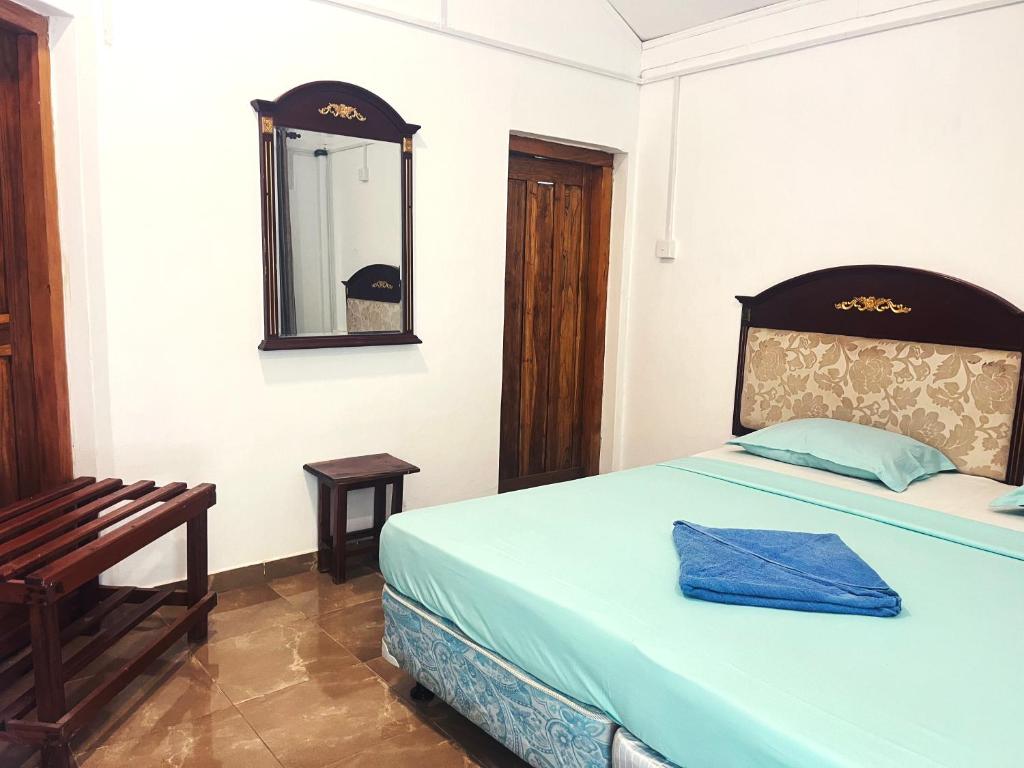 Postel nebo postele na pokoji v ubytování Tristar beach hotel