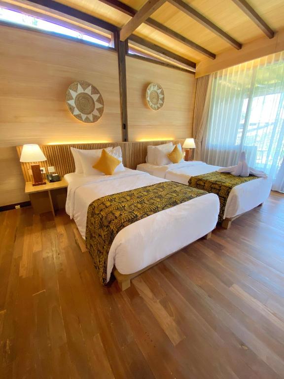Postel nebo postele na pokoji v ubytování Villa So Long Banyuwangi - Ijen