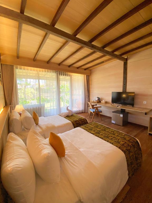 Postel nebo postele na pokoji v ubytování Villa So Long Banyuwangi - Ijen