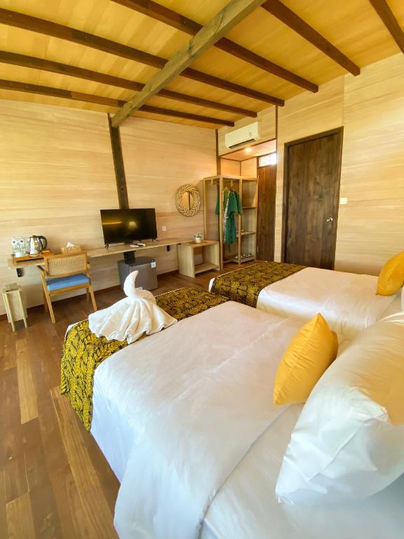 Postel nebo postele na pokoji v ubytování Villa So Long Banyuwangi - Ijen