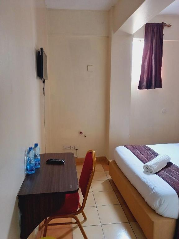 Postel nebo postele na pokoji v ubytování Fahari Bliss Hotel
