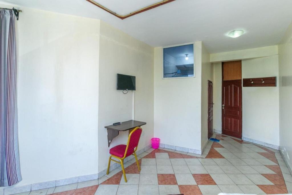 TV a/nebo společenská místnost v ubytování Fahari Bliss Hotel