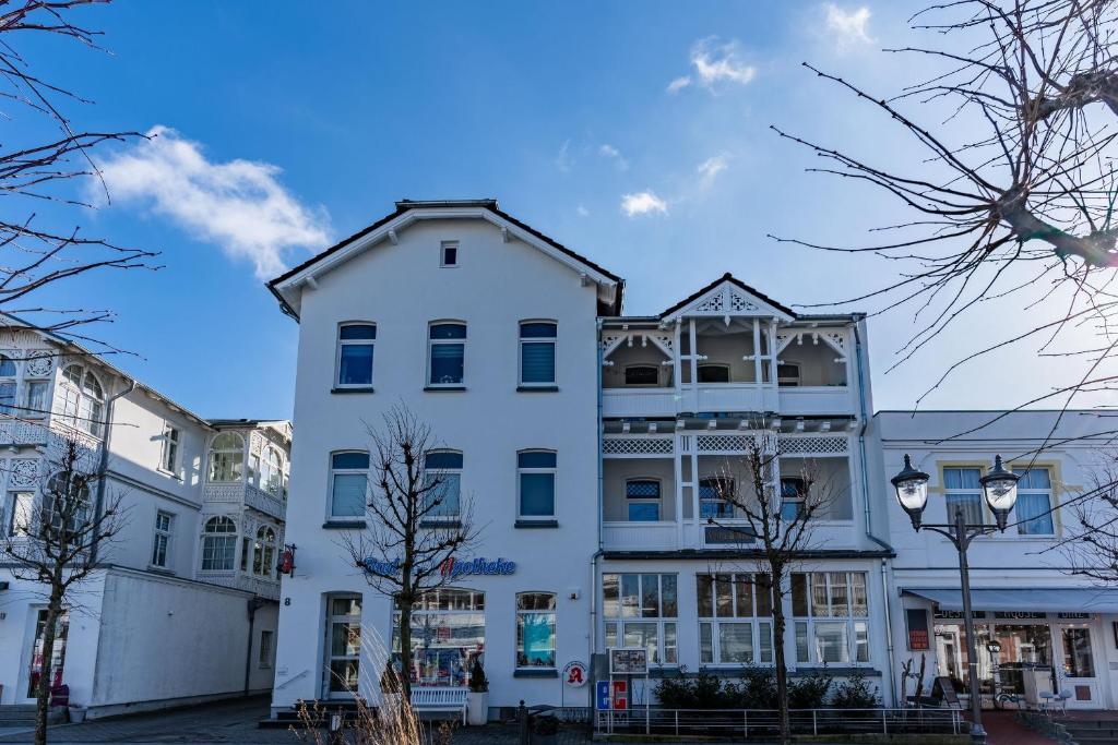 a white building in a city at Villa Seiler Fewo 6 in Binz