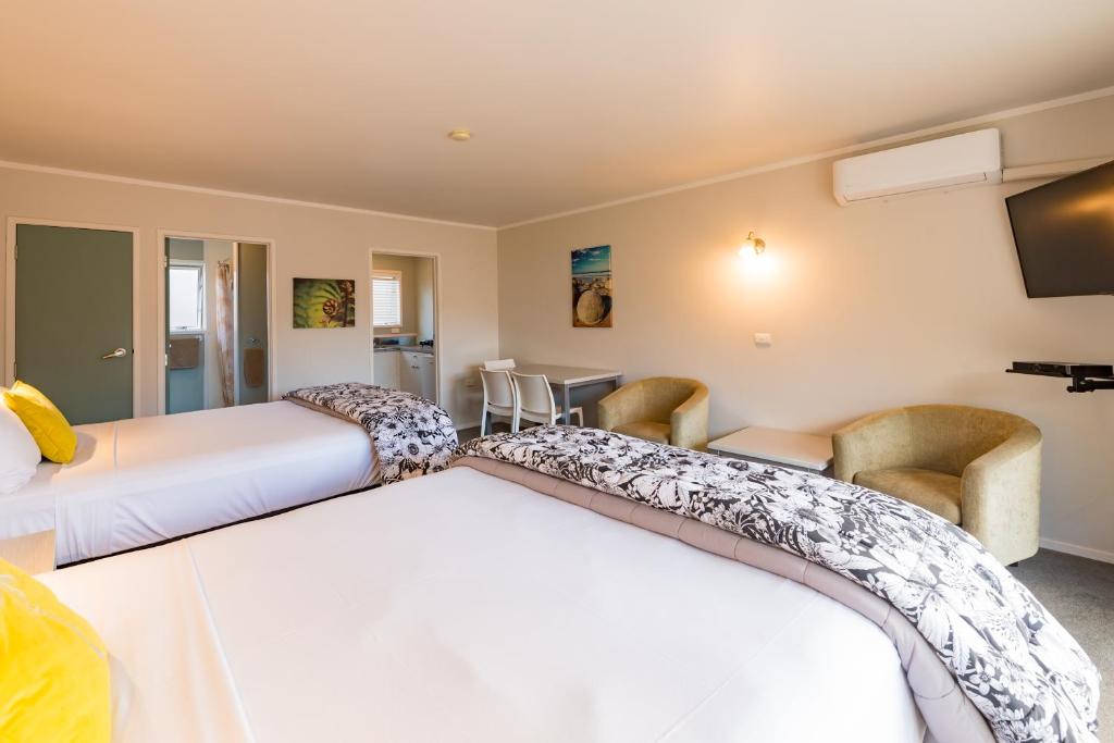 Postel nebo postele na pokoji v ubytování Averill Court Motel